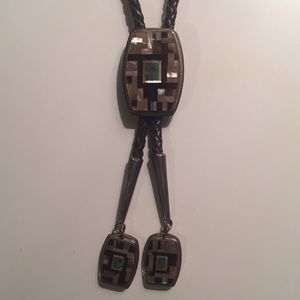 Bolo tie with silver and stone, braided leather